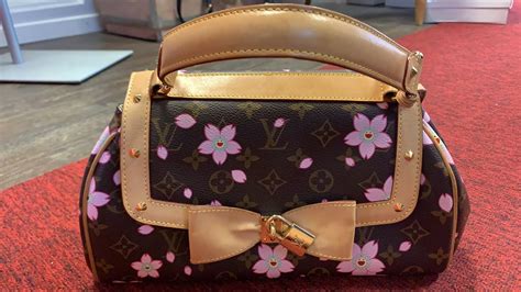 louis vuitton cherry blossom purse fake|louis vuitton mahina blossom bag.